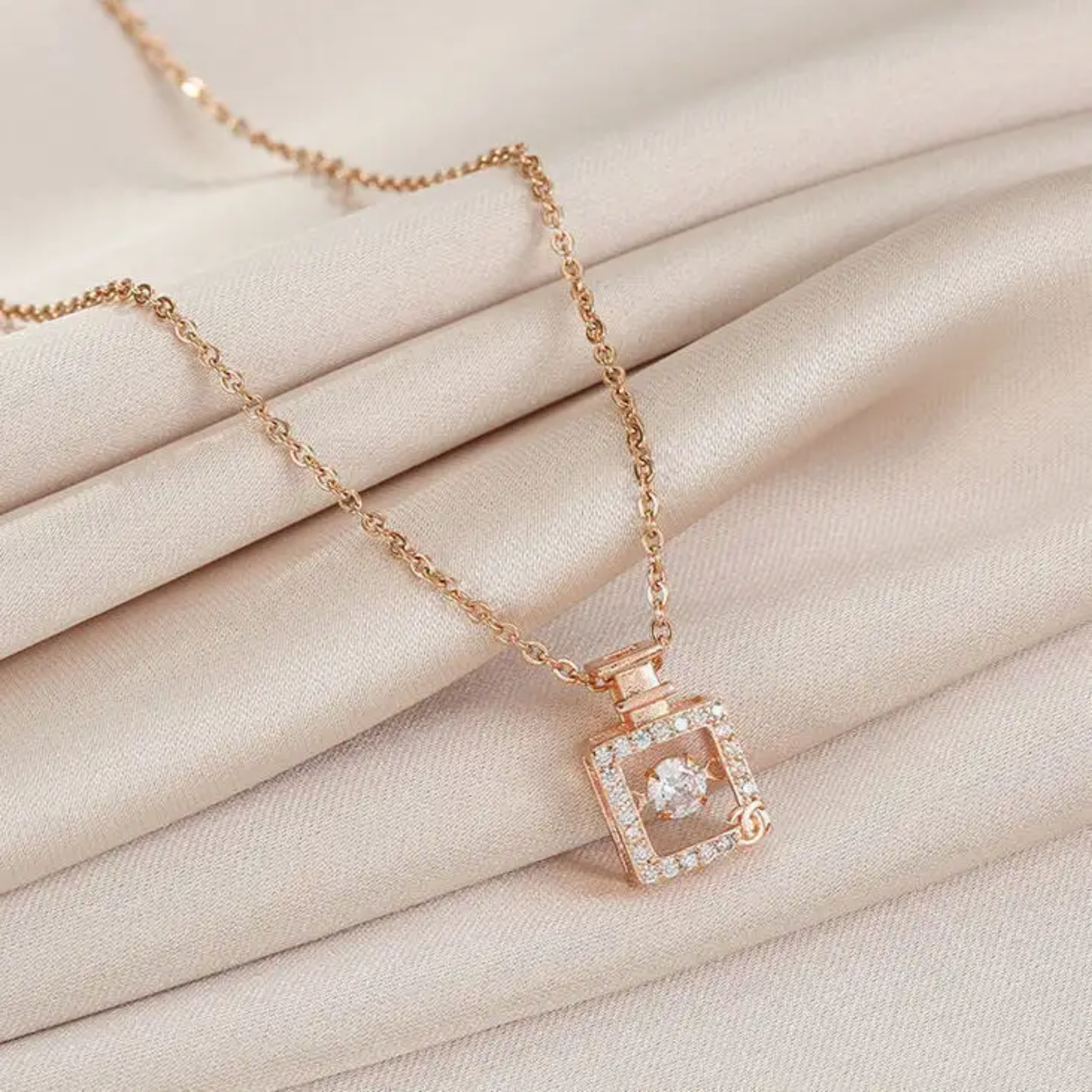 Dancing Diamond Perfume Bottle Shape Pendant With Chain - Rose Gold