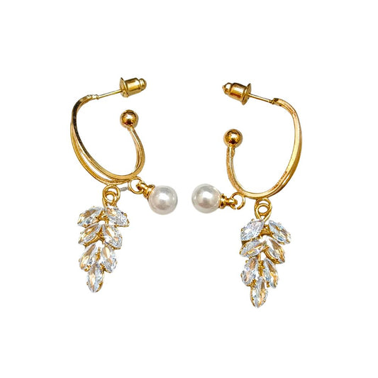 Gold hoop earrings with pearl accents and sparkling leaf-shaped crystals, ideal for weddings, formal events, or everyday elegance.