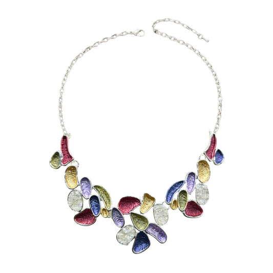 A vibrant multicolor statement necklace with purple, gold, red, and green enamel accents on an adjustable silver-tone chain