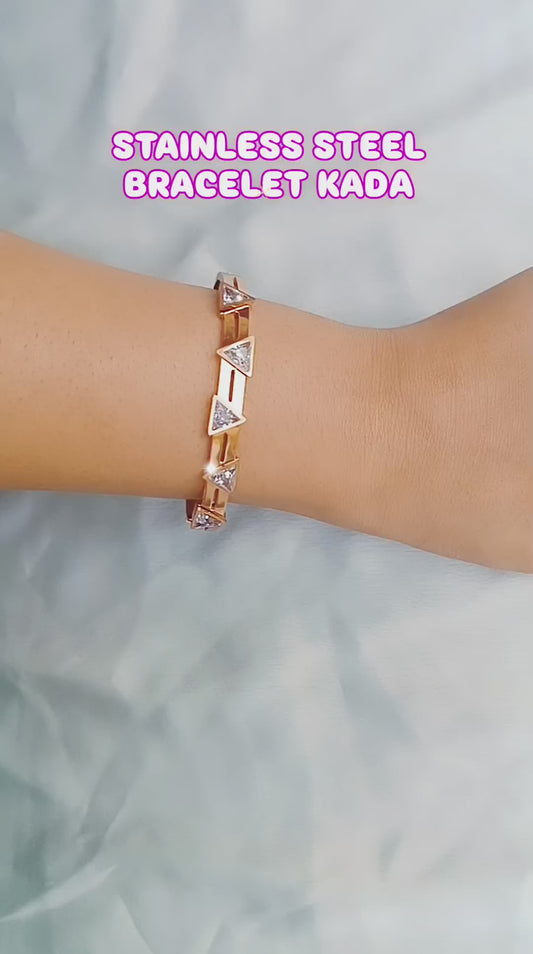 Rose gold bracelet with triangle-cut cubic zirconia stones, minimalist geometric design, perfect for stacking or wearing solo, modern chic jewelry accessory.