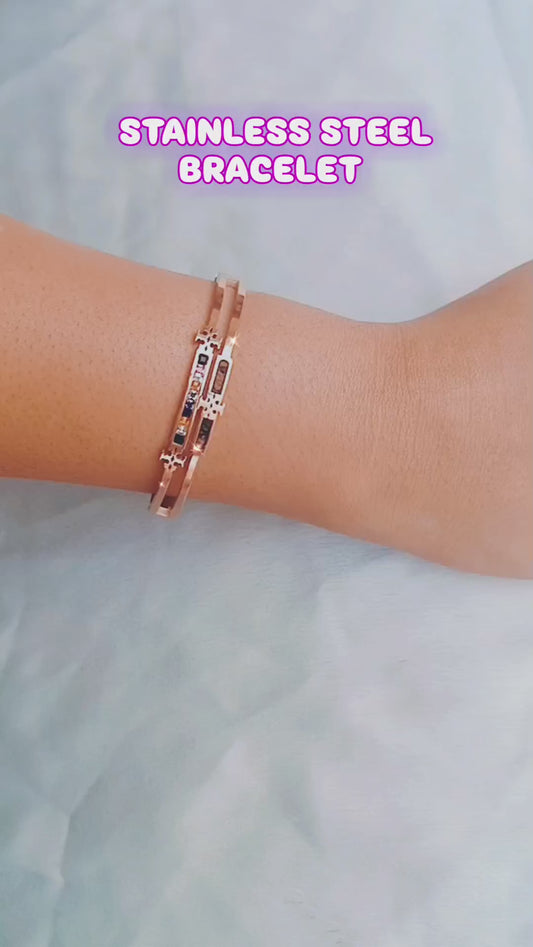 Rose gold bracelet featuring vibrant multicolor gemstones and intricate cutout detailing, perfect for stylish and elegant women.