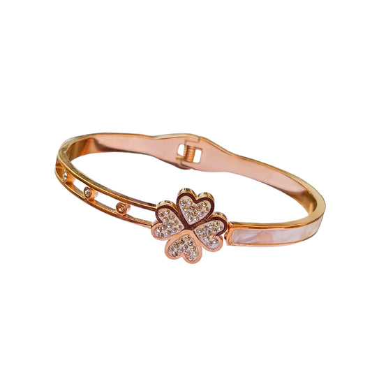 Rose gold bracelet with a four-leaf clover charm, encrusted with crystals