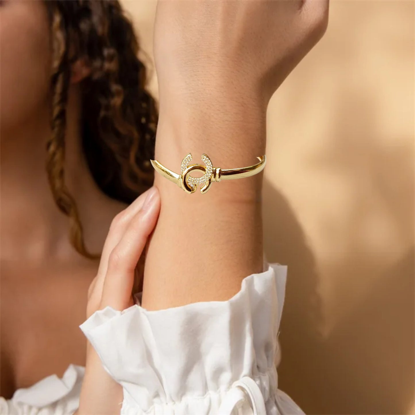 
Crystal-embellished bangle bracelets in gold, silver, and rose gold finishes